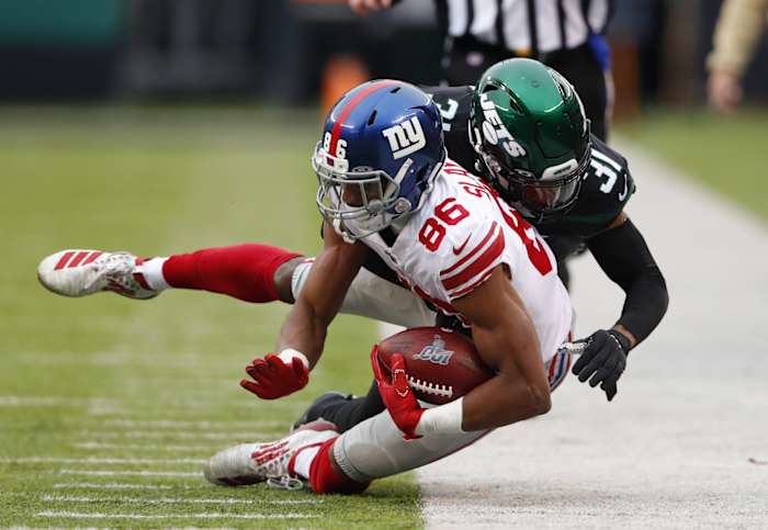 Nov 10, 2019; East Rutherford, NJ, USA; New York Giants wide receiver Darius Slayton (86) is tackled by New York Jets defensive back Blessuan Austin (31) during the second half at MetLife Stadium.